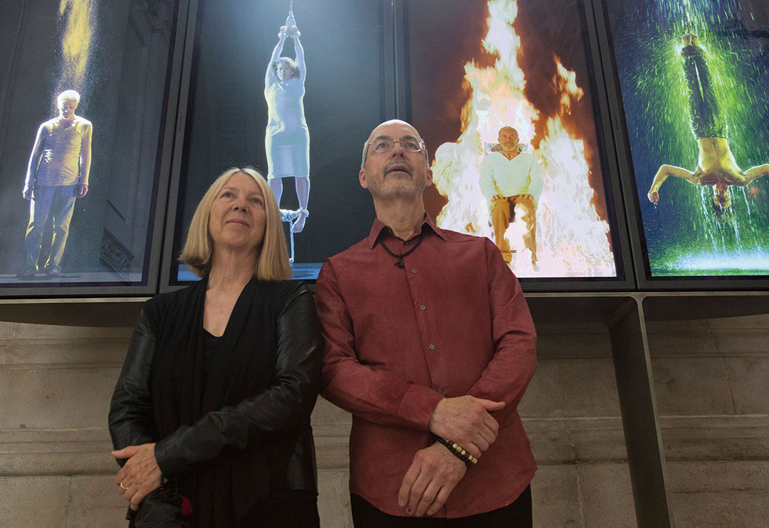 Bill Viola and Kira Perov in front of the permanent video installation Martyrs