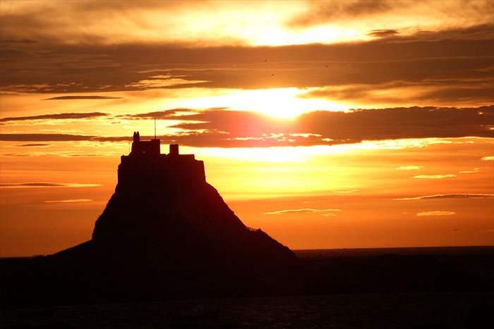 Lindisfarne at sunset. Photograph by Richard Twinch