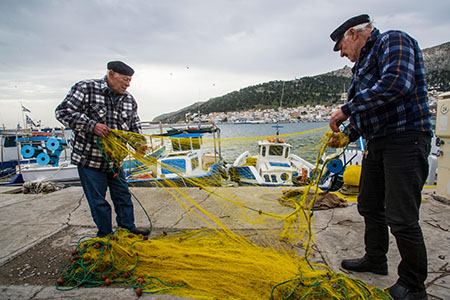 Fishermen on the harbour at Kalymnos, Greece