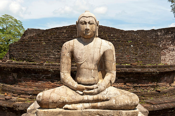 Seated Buddha statue made of stone in a meditation posture, Polonnaruwa, Sri Lanka