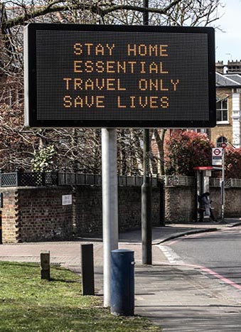 2BAK33P 'Stay At Home' advisory signs across the capital of London to try and 'delay phase' the Coronavirus by keeping people at home, London, United Kingdom