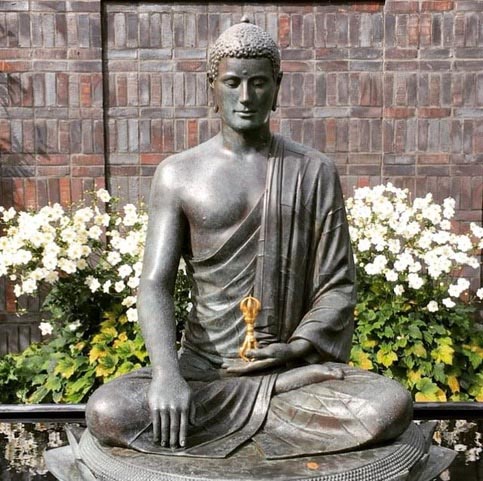 Statue of the Buddha in the courtyard of the Vajrasana Retreat Centre