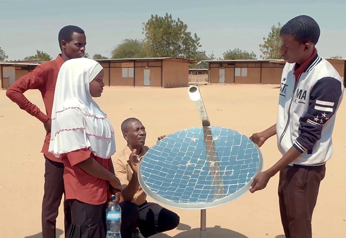 School teacher Omar shows his pupils how to set up a solar cell
