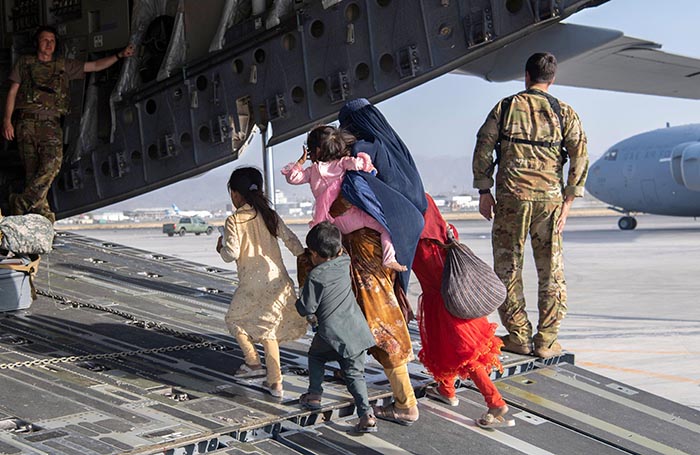 U.S. Air Force loadmasters and pilots assigned to the 816th Expeditionary Airlift Squadron, load passengers aboard a U.S. Air Force C-17 Globemaster III in support of the Afghanistan evacuation at Hamid Karzai International Airport (HKIA), Afghanistan, Au