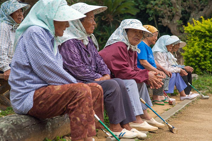 Elderly Japanese Ryukyuan women playing gateball