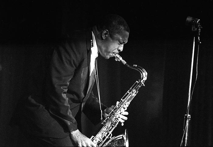 Jazz saxophonist John Coltrane performs at the Salle Pleyel in Paris in 1963