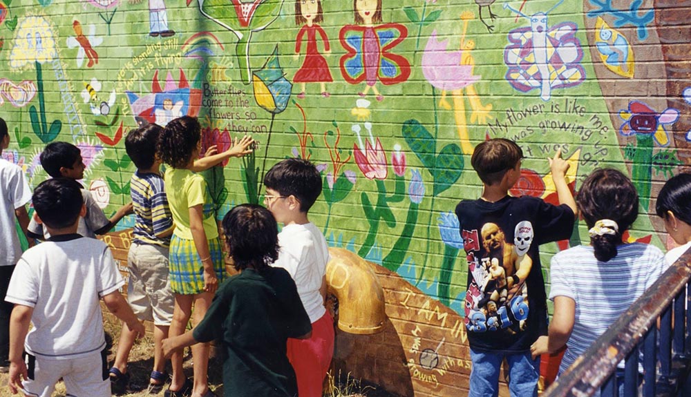 Children painting a wall