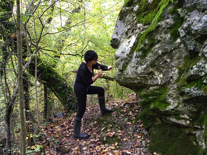 Emily Young working in the wood